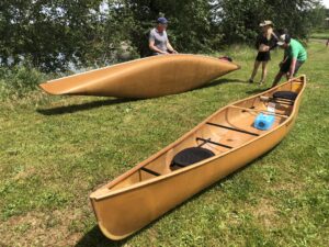 Wenonah Itasca Canoe next to Champlain Canoe