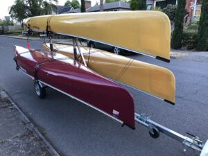 MicroSport Canoe Trailer with three canoes Wenonah Champlain and Seneca